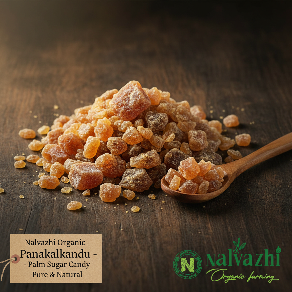 Nalvazhi Organic Panakalkandu Palm Sugar Candy amber golden brown crystals on dark wooden surface with wooden spoon