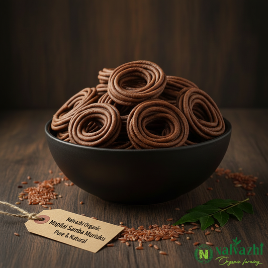 Nalvazhi Organic Mapilai Samba Murukku dark brown spiral murukku in black ceramic bowl on dark wooden table with Mapilai Samba rice grains