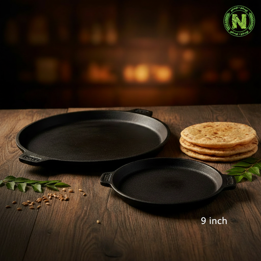 Two sizes of traditional cast iron chapati tawa - 9 inch and 10 inch - with freshly made chapatis on dark rustic wooden surface
