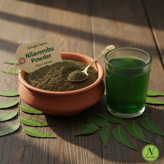 Nilavembu herbal powder in terracotta bowl with glass of nilavembu water and fresh neem leaves