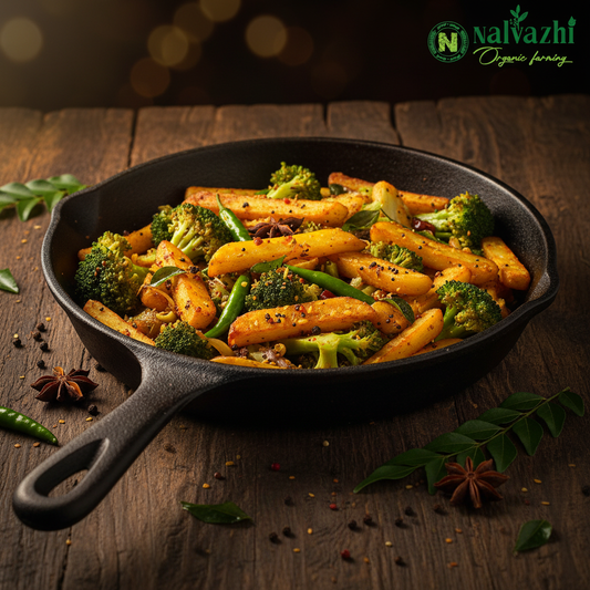 Large 10 inch cast iron frying pan with golden potato fry and broccoli stir fry on dark rustic wooden surface