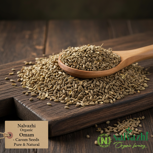 Nalvazhi Organic Omam Ajwain Carom Seeds brownish-green on dark wooden surface with wooden spoon