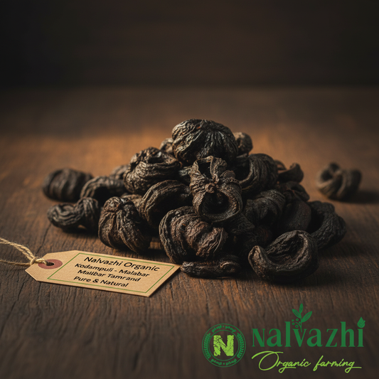 Nalvazhi Organic Kodampuli Malabar Tamarind dried pods on dark wooden surface