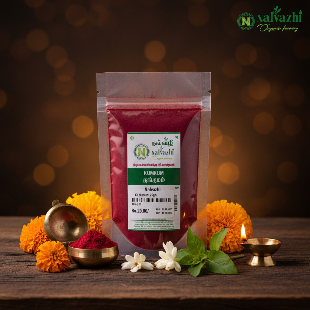 Nalvazhi pure natural kumkum 25g clear packet with deep red kumkum powder surrounded by marigold flowers and glowing brass diya