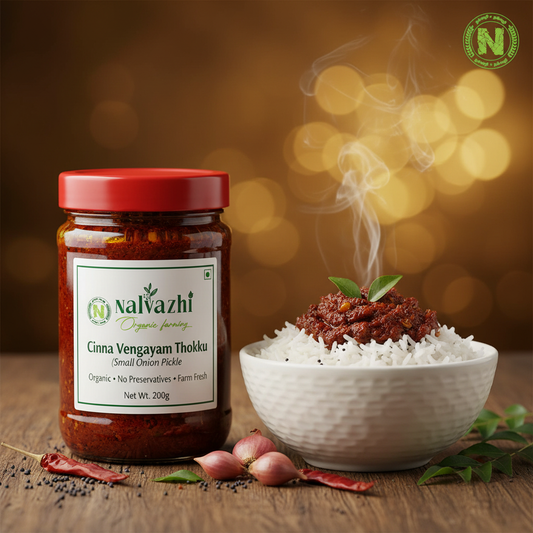 Nalvazhi Cinna Vengayam Thokku jar with steaming rice and thokku served beside it