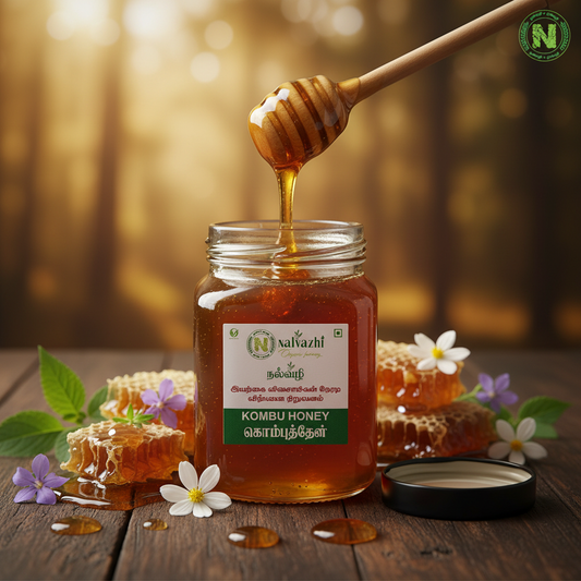 Nalvazhi Wild Forest Kombu Honey - open jar with honey dipper dripping golden honey