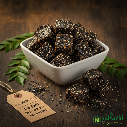 Nalvazhi Organic Ellu Burfi black and white sesame brittle pieces in white bowl on dark wooden table